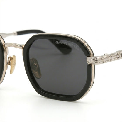 Close-up of intricate 7A quality gothic floral engravings on silver frames