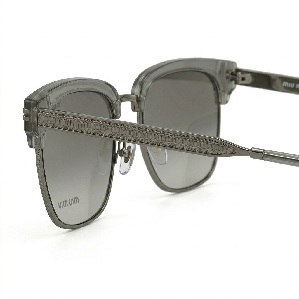 Side temple view of Miu Miu 110 featuring gold-tone logo.